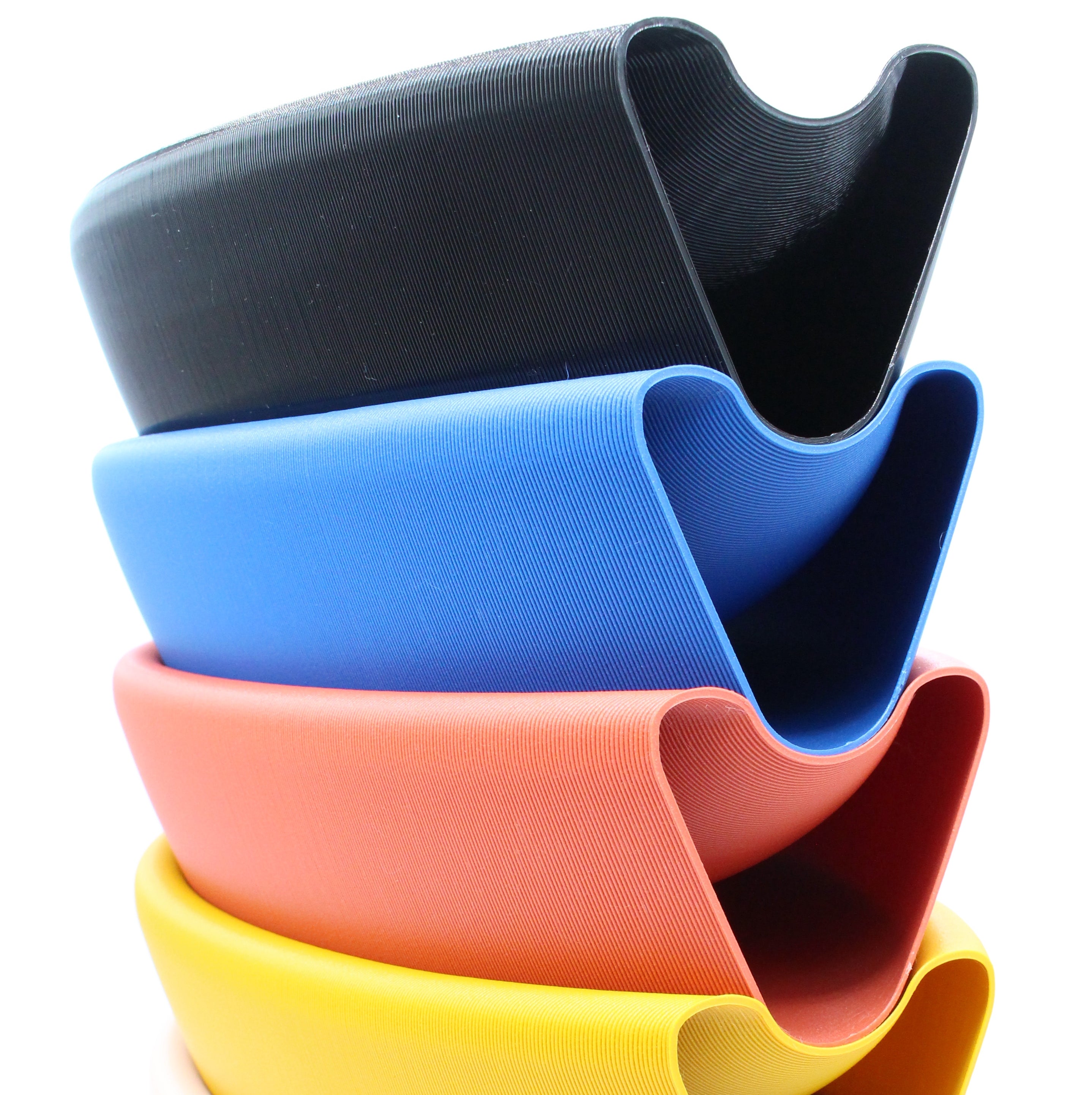 Stack of Aera bowls in various colors made with recycled plastic by Deme Design
