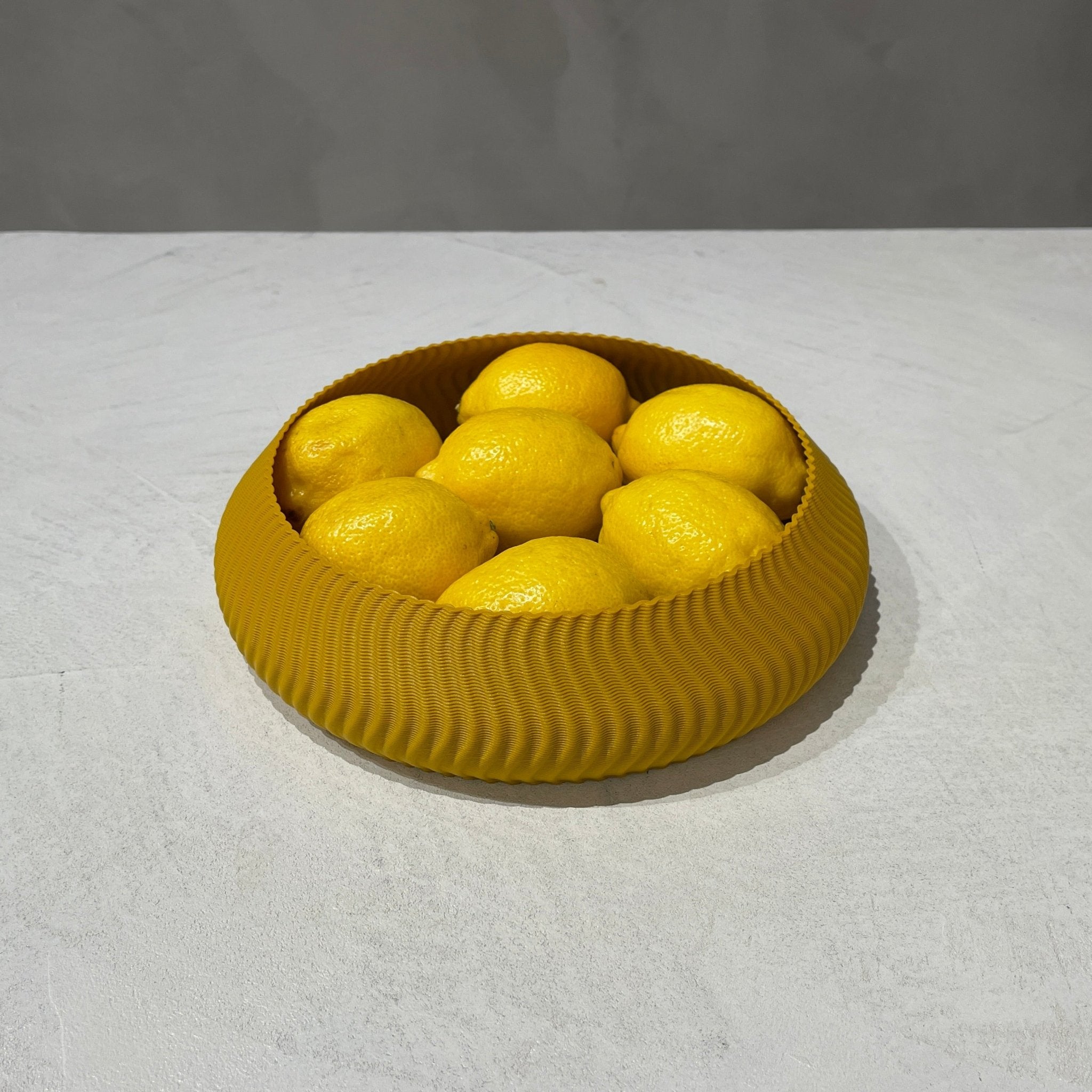 Kyma Bowl Ochre With Fruit, 3D Printed Recycled Plastic, Deme Design #color_ochre